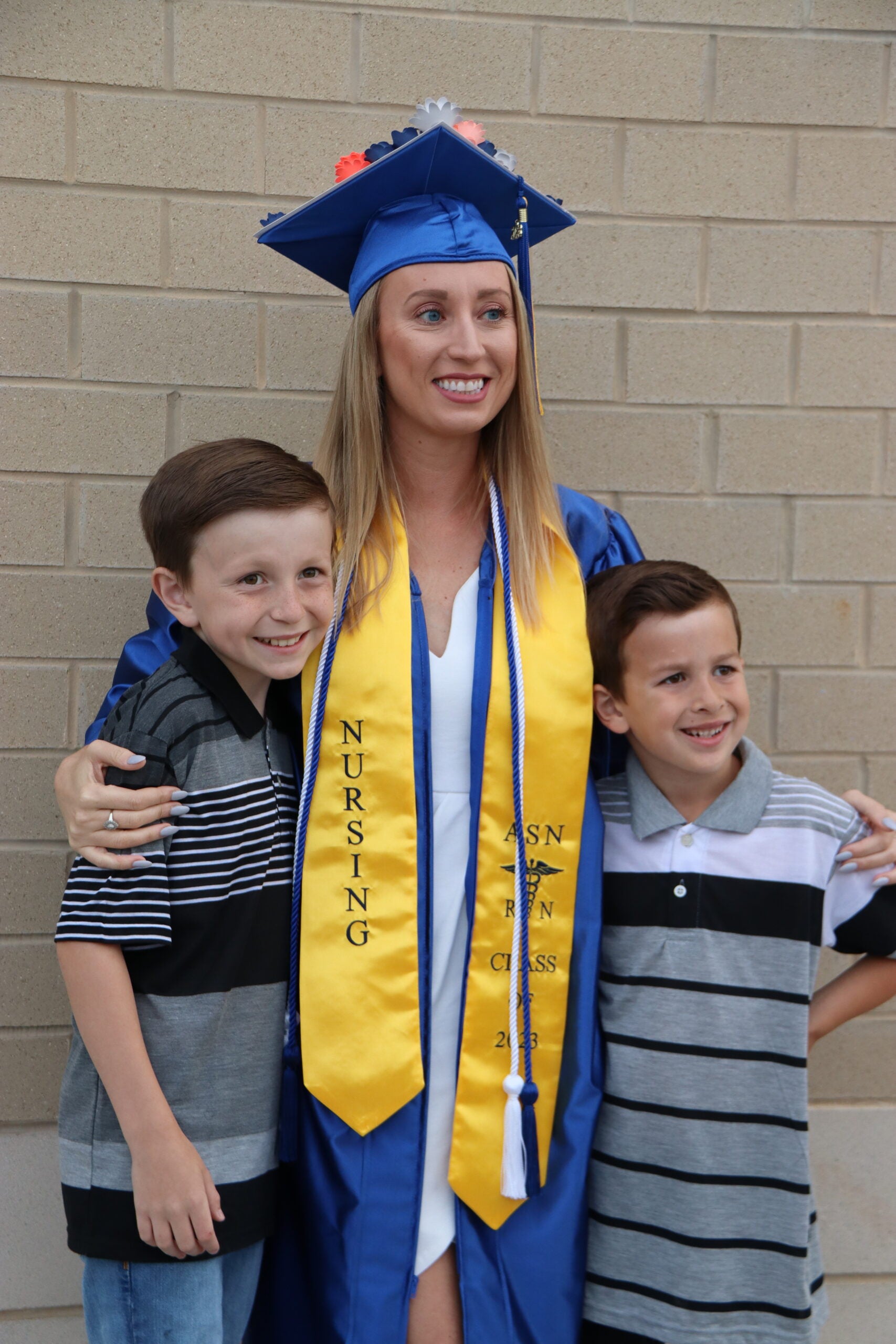 graduate with her sons