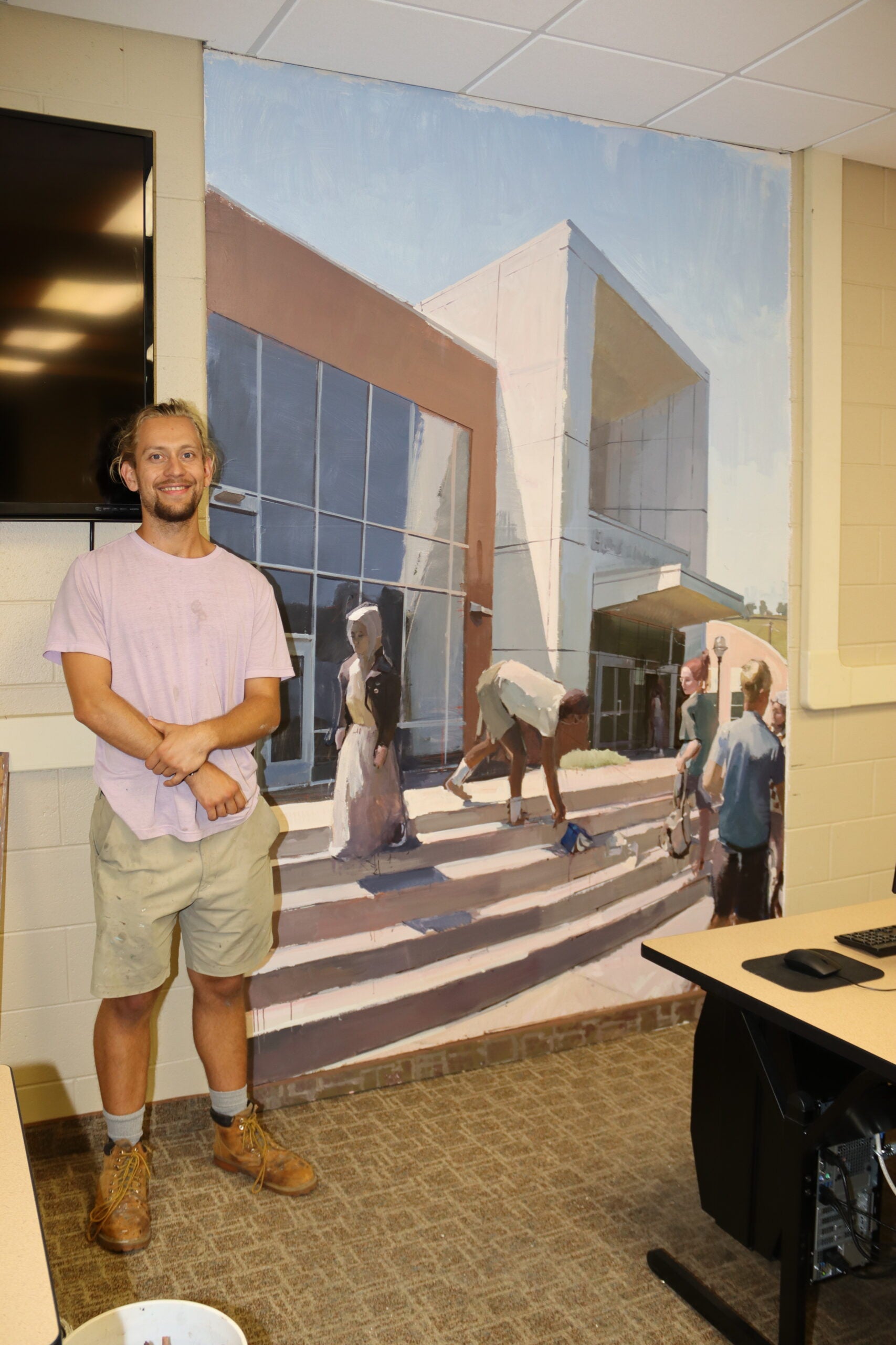 library mural with student artist