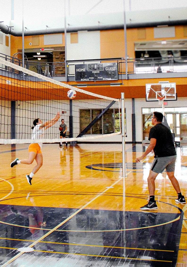 student volleyball game in the gym