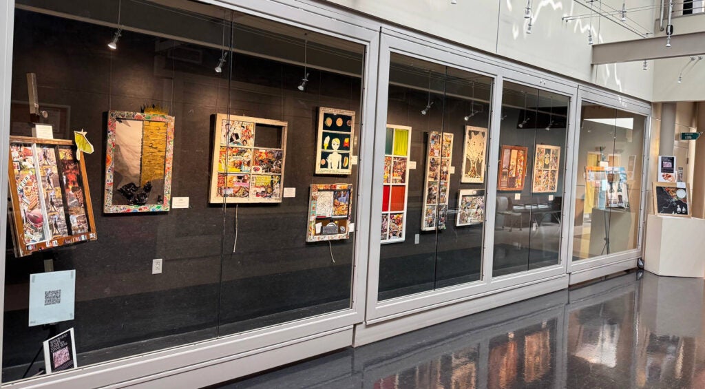 Photo of the whole Kaleidoscope gallery with the Windows to Hunger artworks behind glass