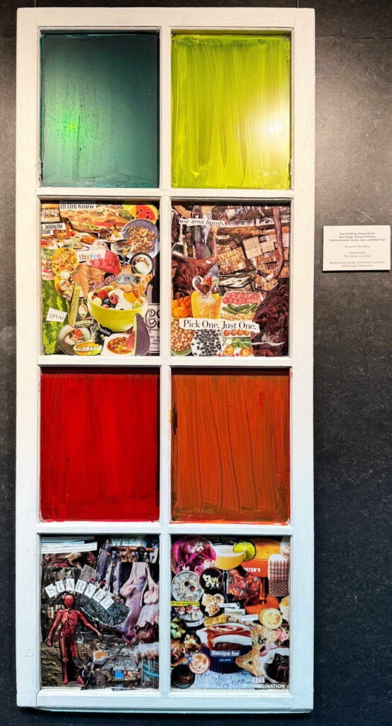 Artwork with eight panes, some of which are colored cloth and some are collages