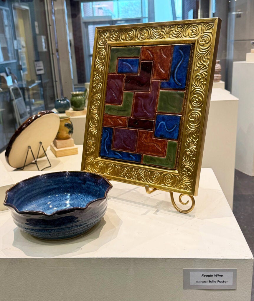 blue bowl and tiles assembled in a frame