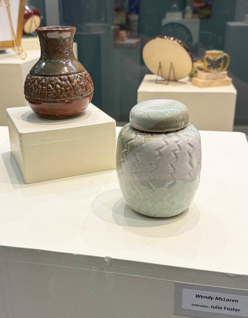 brown vase and gray lidded pot