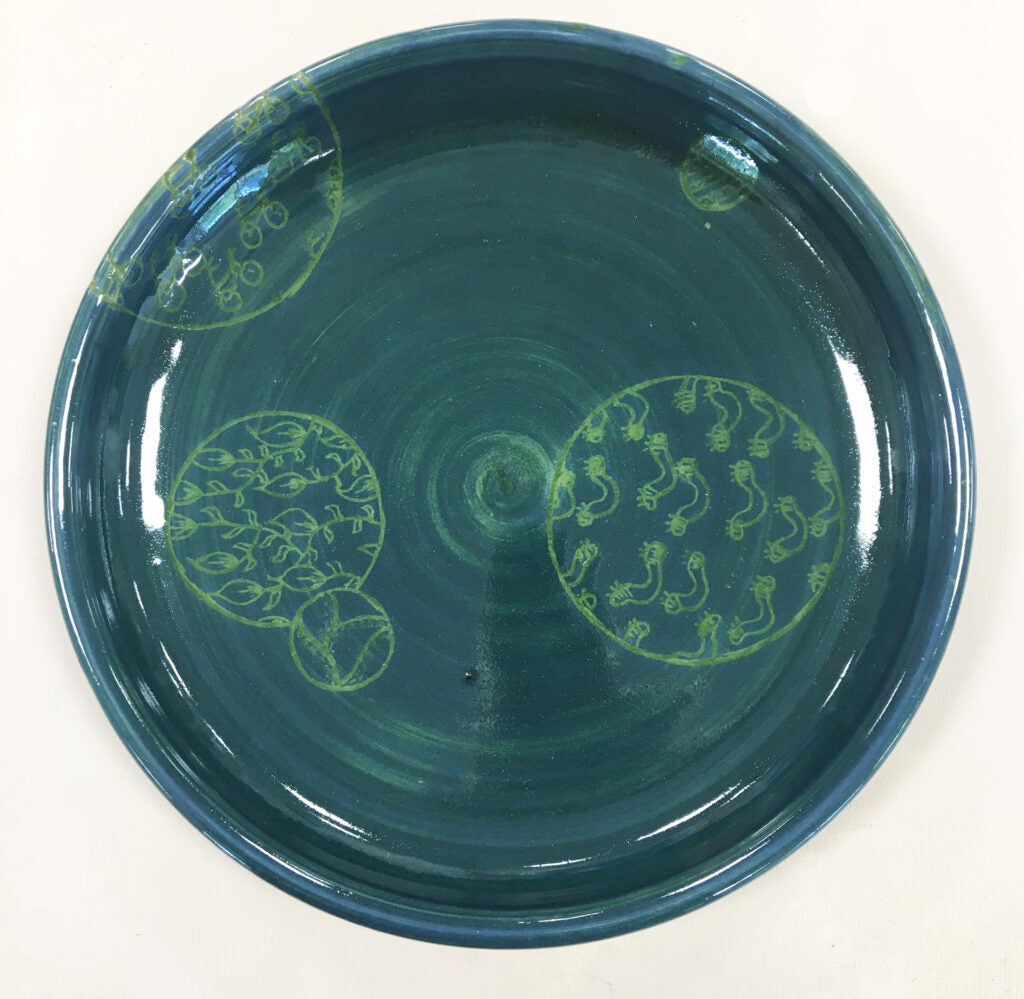 Round blue-green plate with green design of biological organisms, entitled "Keep it Green 1" 2024 by Jessica Martinkosky