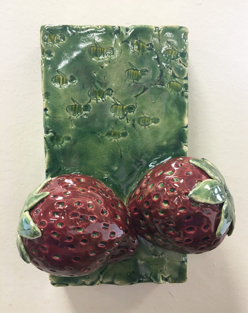 Ceramic sculpture of strawberries entitled "tasty pollination 2" by Jessica Martinkosky