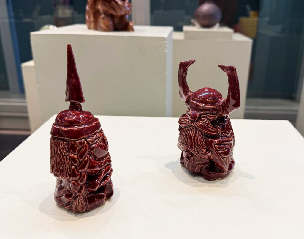 red-glazed figures with beards and angular helmets